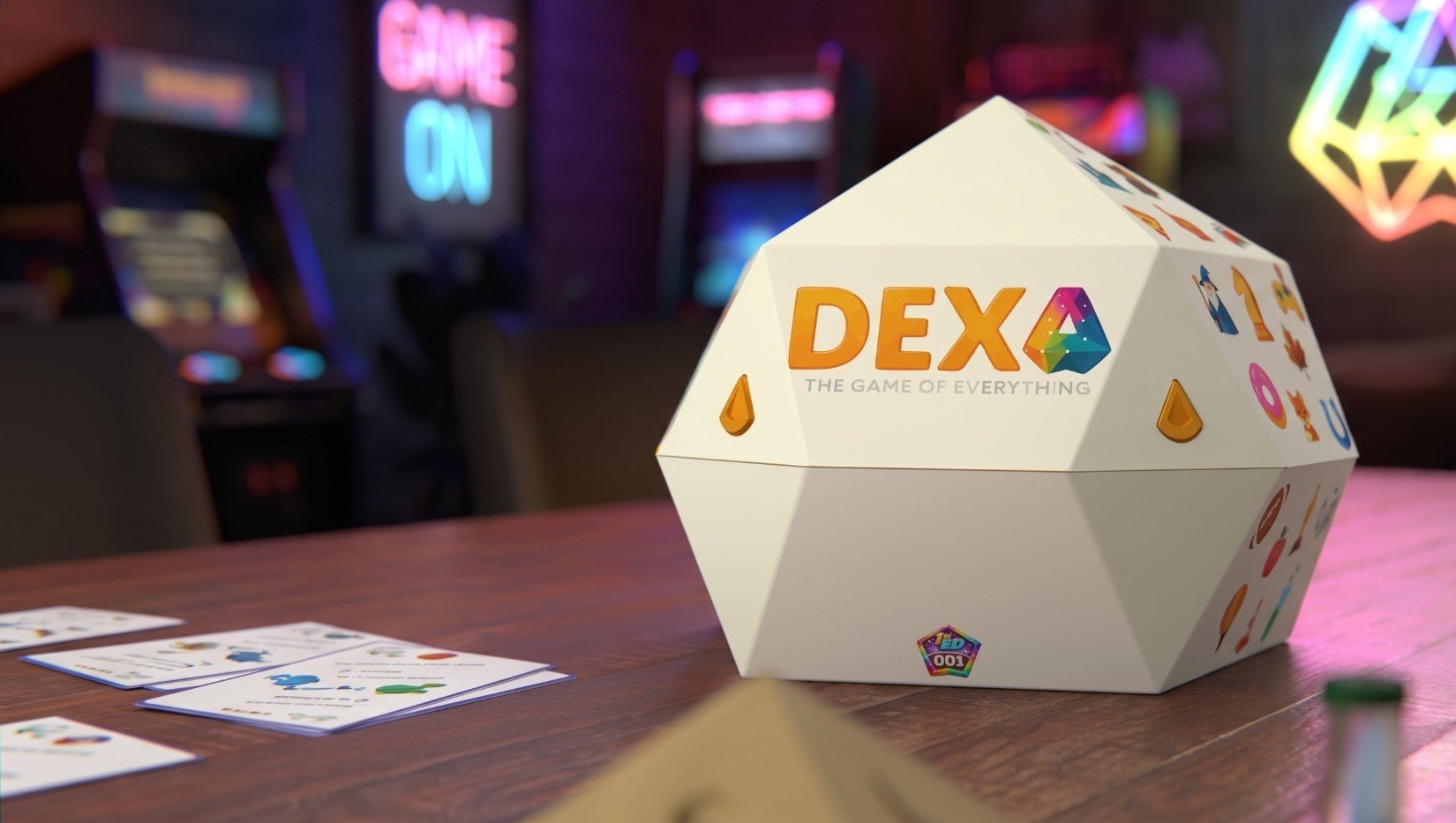 The DEXA 1st Edition unit sitting on the table, lit by arcade neon